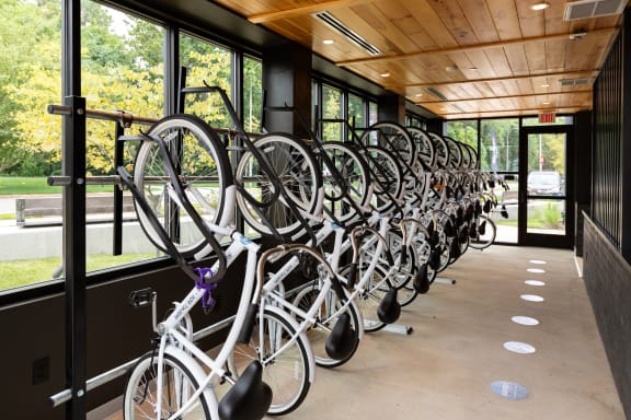 a row of bikes on a bike rack in front of a building  at Abberly Riverwalk Apartment Homes, Nashville, Tennessee