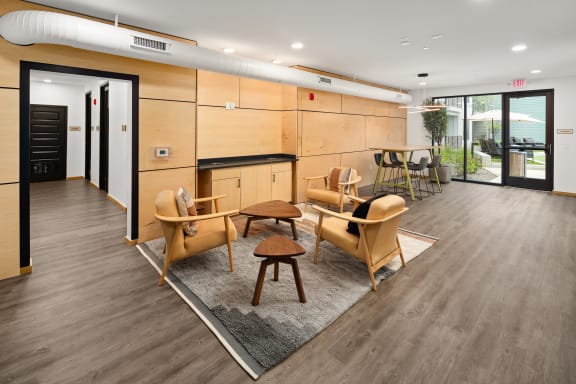 a common area with chairs and tables  at Abberly Riverwalk Apartment Homes, Nashville, 37228