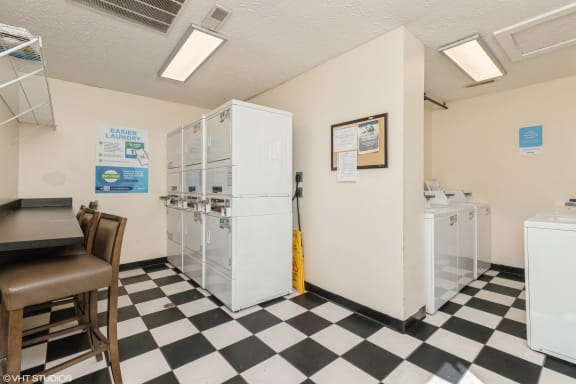 a kitchen with a checkered floor and a refrigerator at Springburne at Polaris Apartments, Columbus, OH