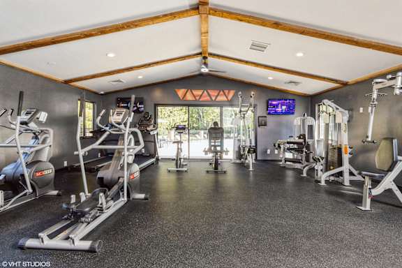 A gym with a variety of equipment including treadmills, weights, and exercise machines at Karric Place of Dublin Apartments, Dublin, 43016