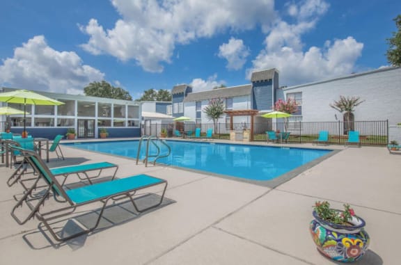 our apartments have a large pool and lounge chairs at Whispering Oaks, Conroe, TX ?