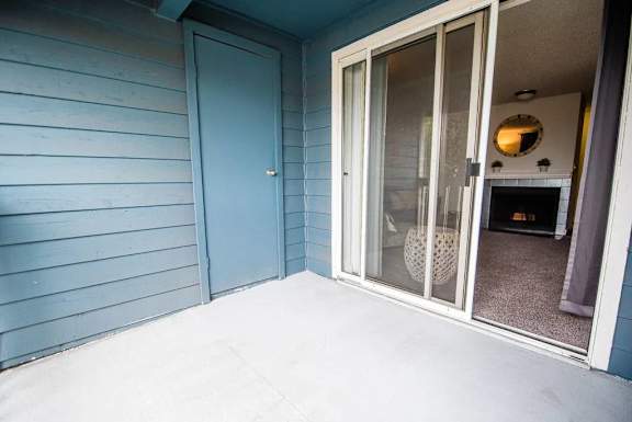 A blue door is on the left and a glass door is on the right.