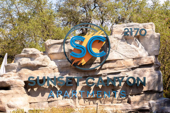 a sign for the sunseeker canyon apartments