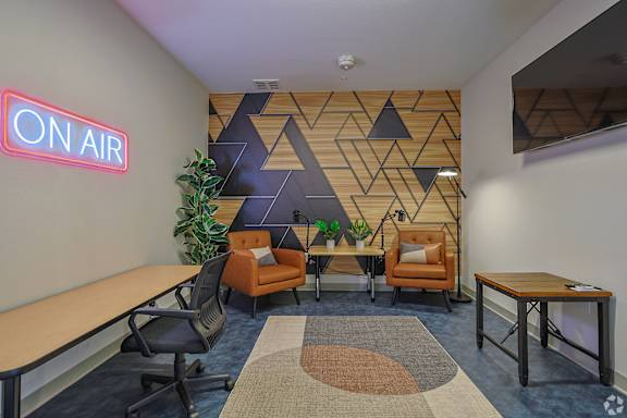 A room with a neon sign at The Virginia Apartments , Seguin