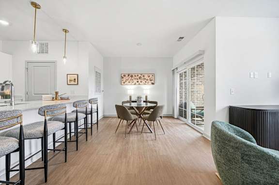 A dining area with a table set for four.