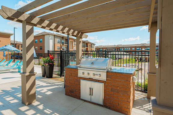 a patio with a barbecue grill