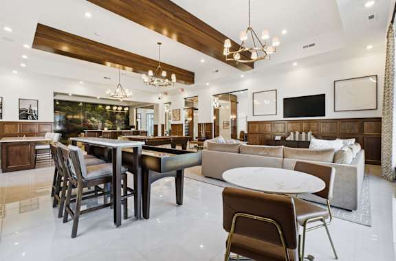 A modern dining room with a wooden table and chairs.