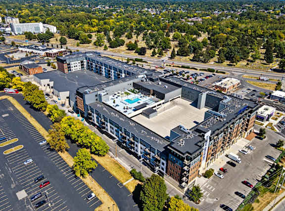 A large building with a pool in the middle of it.