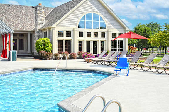 a swimming pool in front of a house