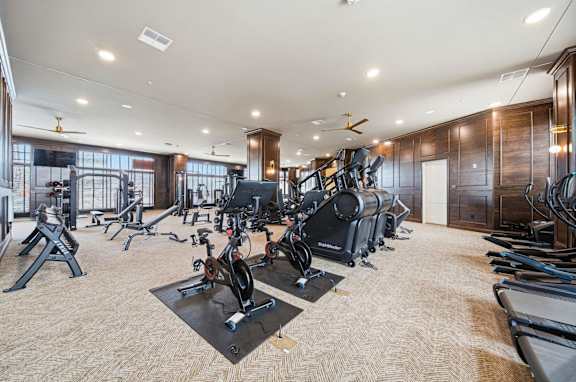 A spacious gym with a variety of exercise equipment.