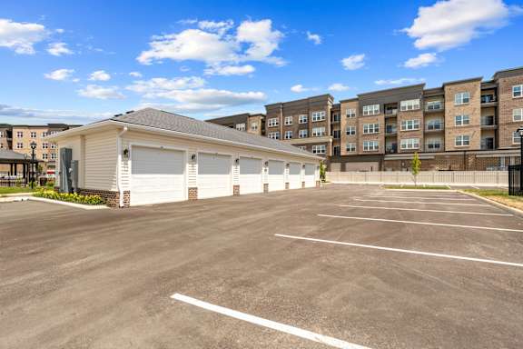 A large, empty parking lot in front of a building.