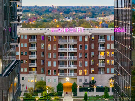 A large red brick building with the words HIGH POINT on the top.