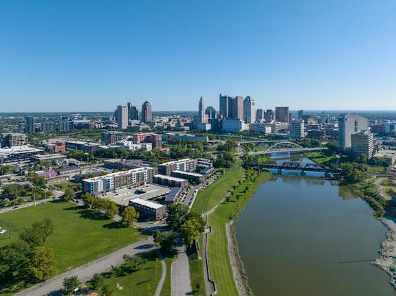A cityscape with a river running through it.