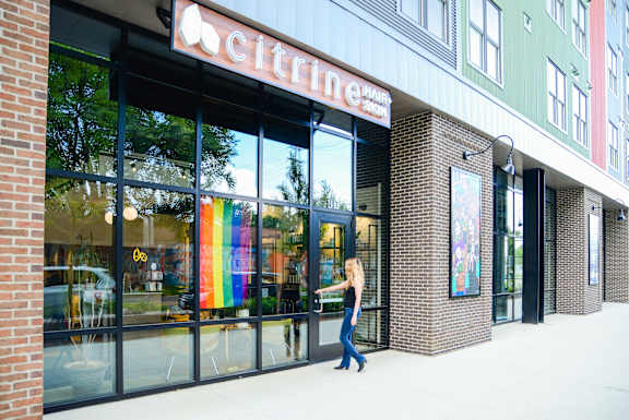 A woman walks out of a Citrine store.