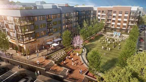 A rendering of a modern apartment complex with a food hall and a park.