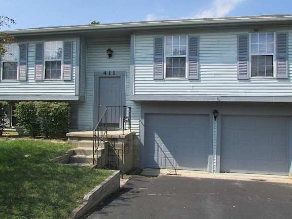 A house with a blue garage door.