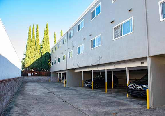 A parking garage with cars parked in it.