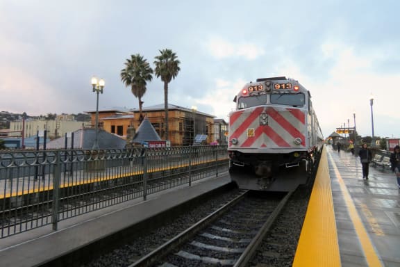 a train pulling into the San Carlos caltrain station