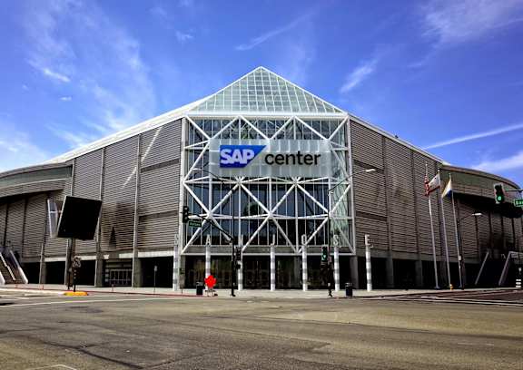 the sap center on the corner of a city street