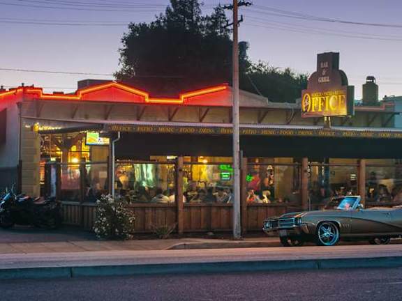 a car parked in front of a restaurant