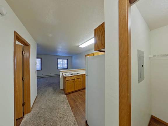 A kitchen area with a sink and a window.