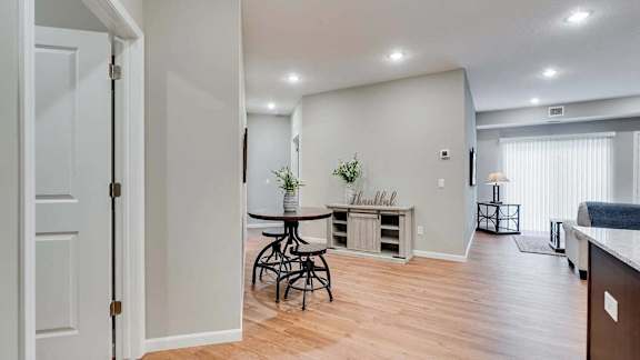 an open living room with a dining room and a kitchen.  Circle Pines, MN Lexington Lofts