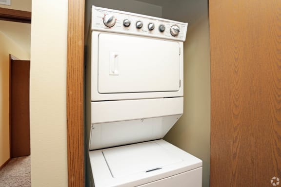 a washer and dryer in a room at Benson Village Townhomes Apartments, Sioux Falls, SD