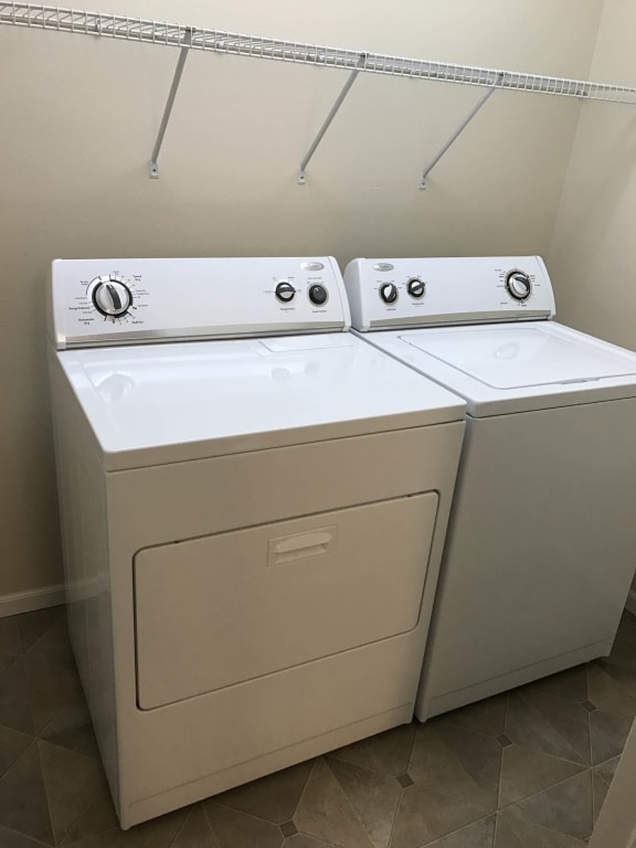 a washer and dryer in the laundry room at Boulder Ridge Apartments, North Dakota