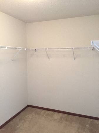 Walk-In Closets With Built-In Shelving at Pelican Heights Apartments, Detroit Lakes, MN