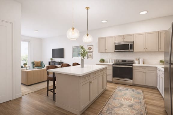 A kitchen with a white island and wooden floors.
