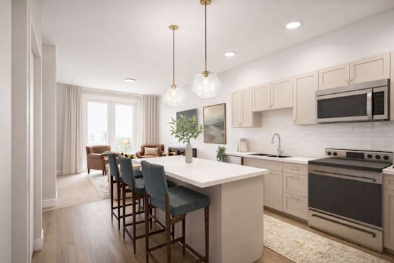 A modern kitchen with a large island and bar stools.