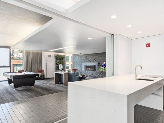 an open kitchen and living room with a pool table at One 333, Chicago, Illinois