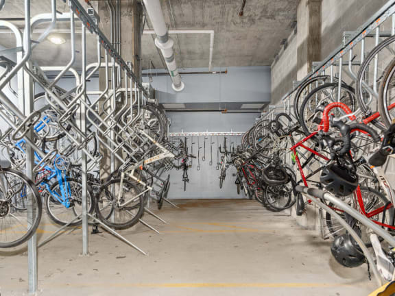 a row of bikes parked in a parking garage at One 333, Chicago, Illinois, 60605