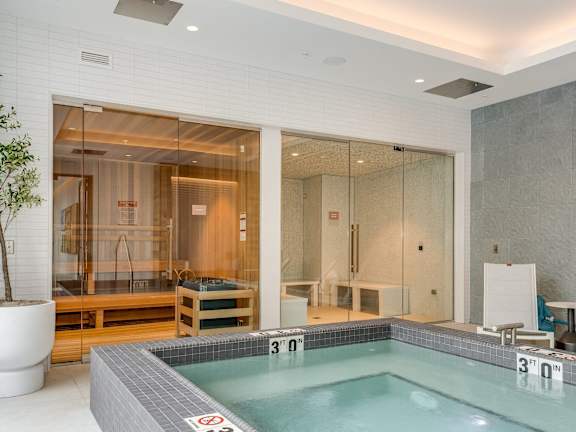 A small indoor pool with a no-diving sign.