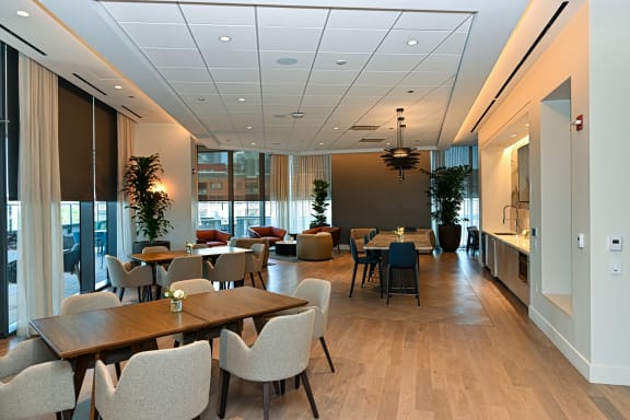 a large dining room with tables and chairs and a kitchen  at Cassidy on Canal, Chicago, 60606