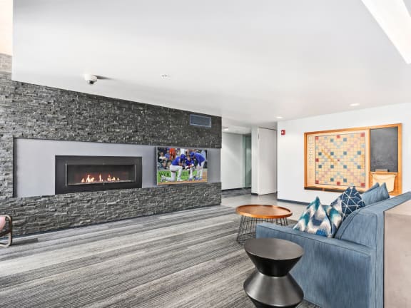 a living room with a fireplace and a couch at One 333, Chicago, Illinois, 60605