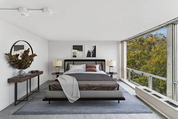 a bedroom with a bed and a large window at The Pavilion, Michigan, 48207