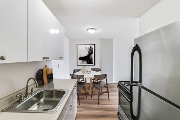 a kitchen and dining area in a 555 waverly unit at The Pavilion, Detroit, MI