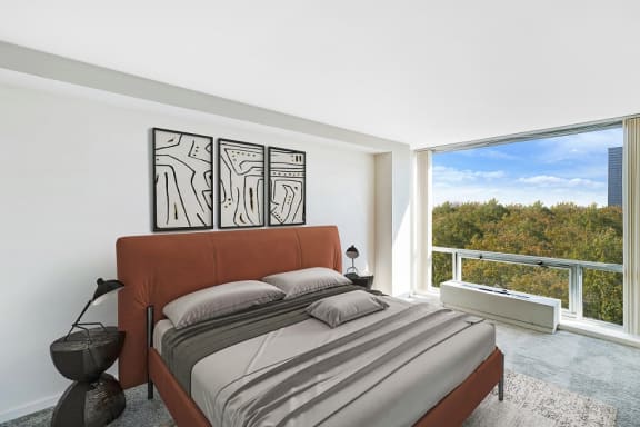 a bedroom with a bed and a large window at The Pavilion, Detroit, MI