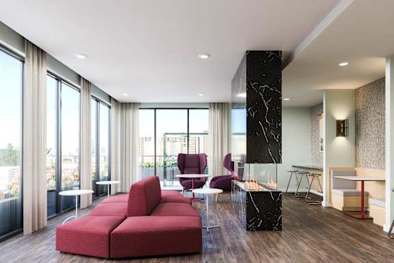 A modern living room with a red sofa and a marble table.