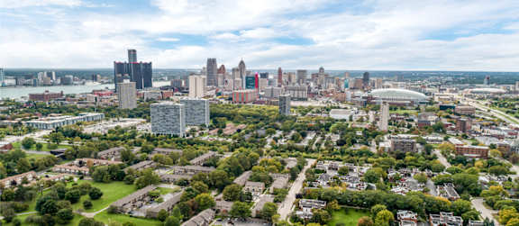 A cityscape with a mix of residential and commercial buildings.
