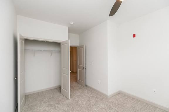A room with a white door and a brown door at 1701 North Apartment Homes Apartments, Chapel Hill