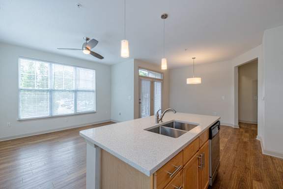 A kitchen with a sink and a fan at 1701 North Apartment Homes Apartments, Chapel Hill, NC, 27514
