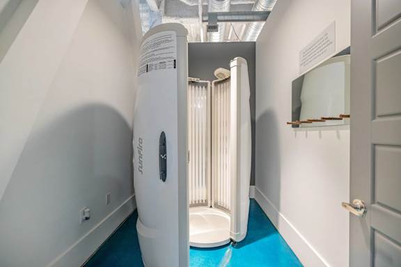 A white portable toilet is in a hallway at 1701 North Apartment Homes Apartments, North Carolina