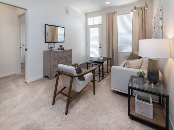 a living room with a couch and a chair at Ardmore at the Trail, Indian Trail, NC