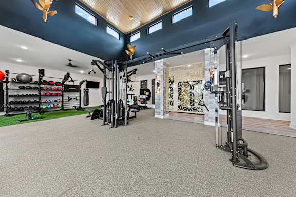 Gym with variety of equipment at Views at Flowers, Clayton, 27527