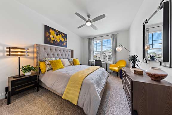 Bedroom with Window and Ceiling Fan at Views at Flowers, Clayton, North Carolina