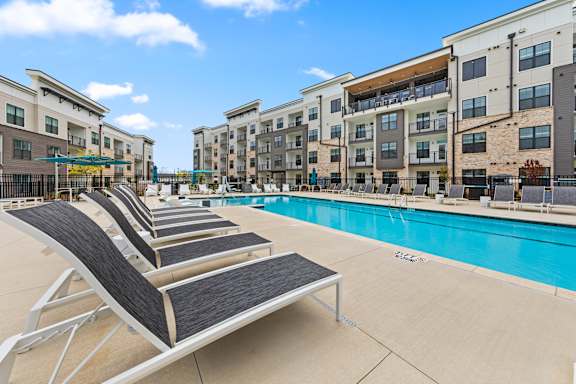 Pool with sun loungers at Views at Flowers, North Carolina, 27527