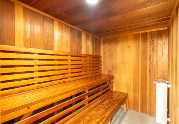 a sauna with a wooden bench and a trash can at Mountainview Venture, California, 91722