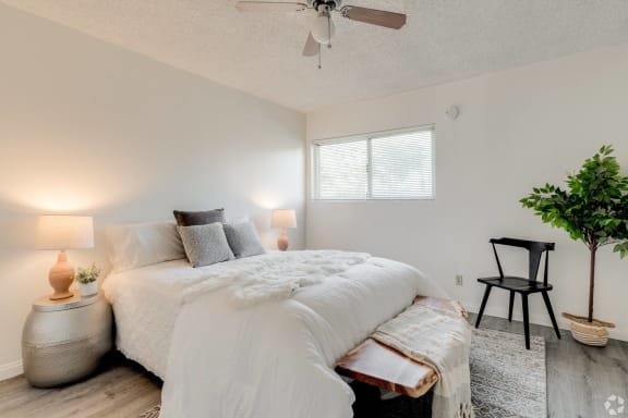 a bedroom with a large bed and a ceiling fan at University Park, California, 91702